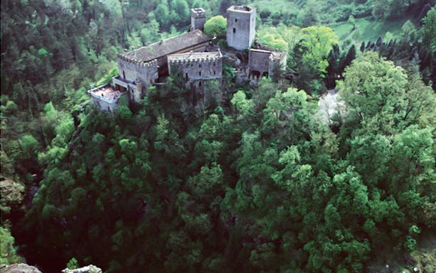 Gropparello Castle surrounded by lush greenery, Italy.