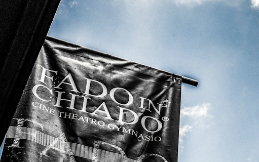 Banner for Fado in Chiado at Cine Theatro Gymnasio against blue sky
