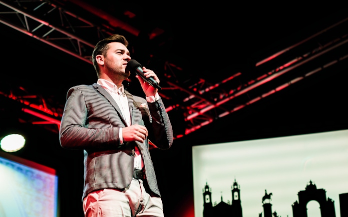 Performer singing Fado on stage in Chiado, Lisbon.