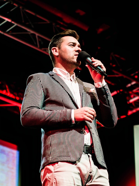 Performer singing Fado on stage in Chiado, Lisbon.