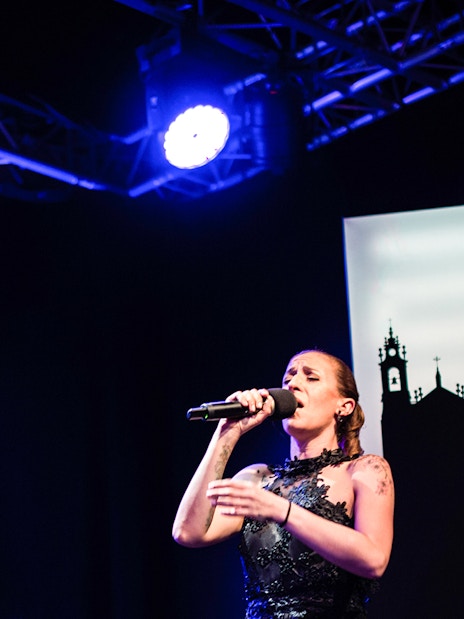 Fado singers performing on stage in Chiado, Lisbon.