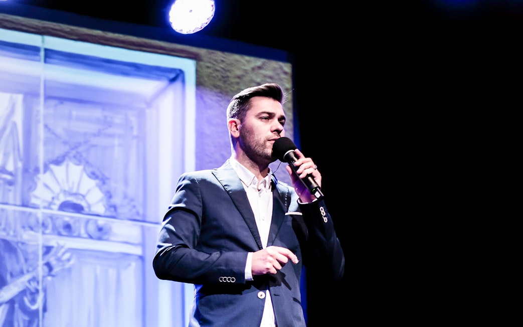 Performer singing at Fado in Chiado show, Lisbon.