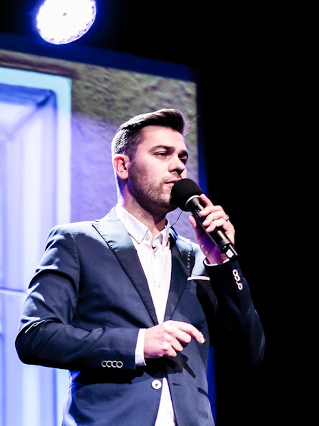 Performer singing at Fado in Chiado show, Lisbon.
