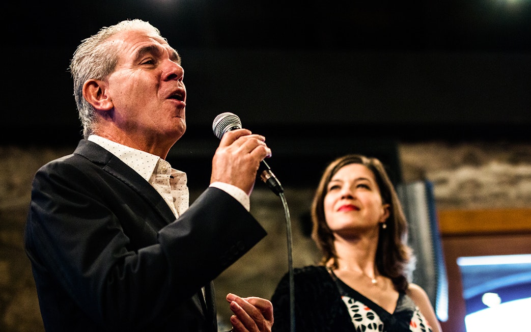 Fado singers performing in a Port wine cellar concert.