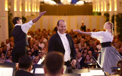 Mozart and Strauss concert at Schönbrunn Palace with performers and audience.