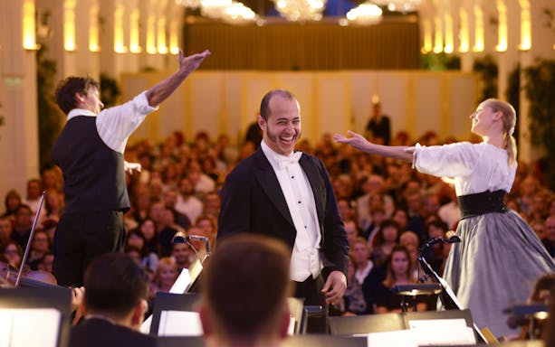 Mozart and Strauss concert at Schönbrunn Palace with performers and audience.