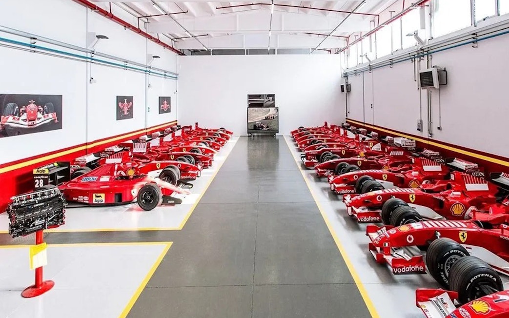 Ferrari race cars lined up at Fiorano Track, Maranello, part of the Panoramic Shuttle Tour.