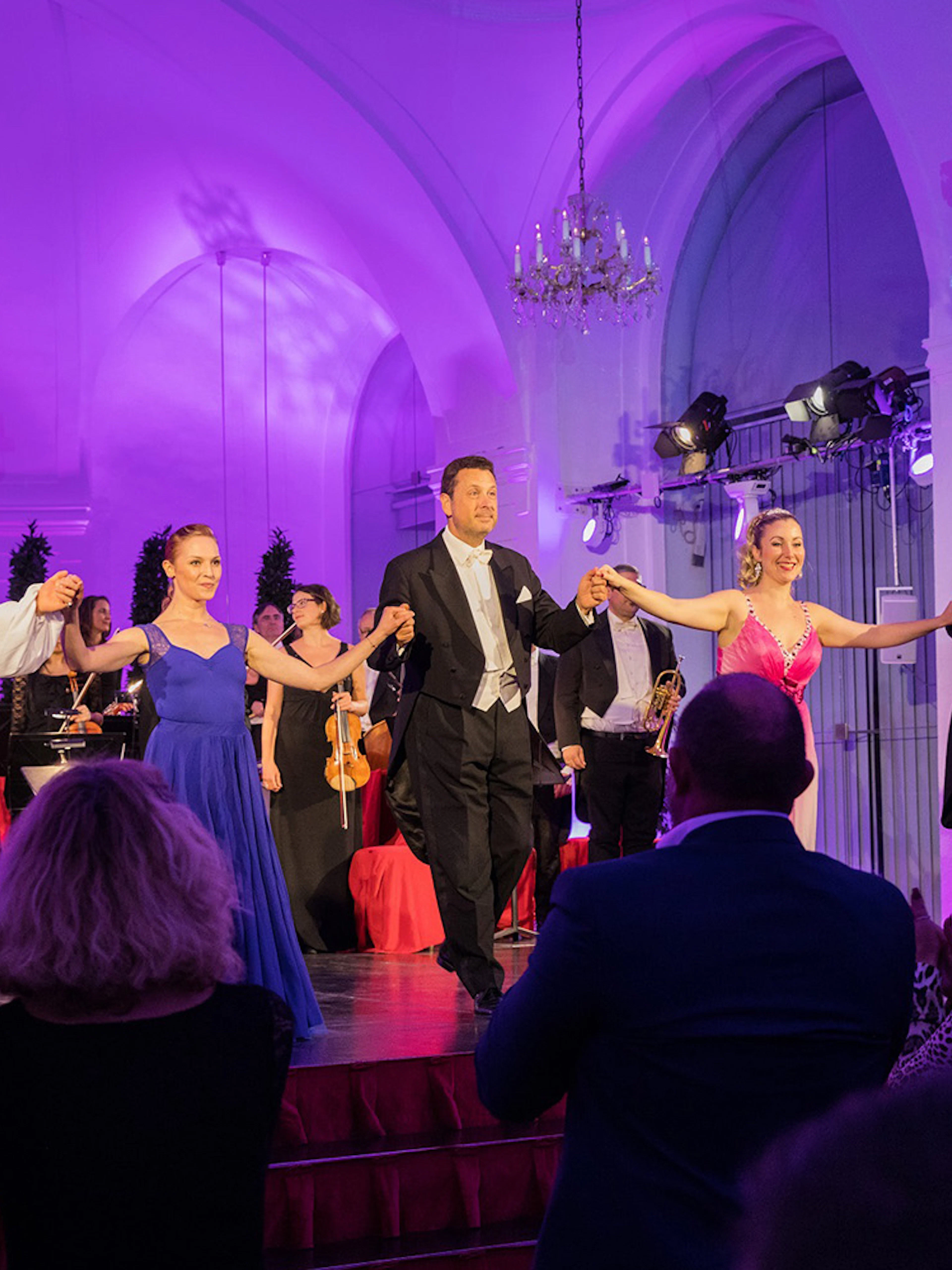 Performers taking a bow at a Mozart and Strauss concert in Schönbrunn Palace.