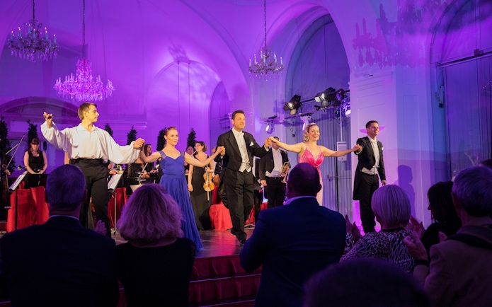 Performers taking a bow at a Mozart and Strauss concert in Schönbrunn Palace.
