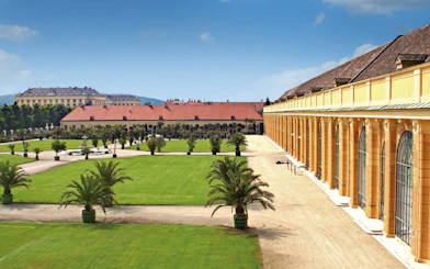 Schönbrunn Palace gardens with historic architecture, Vienna, Austria.