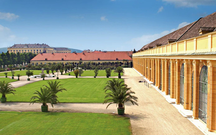 Schönbrunn Palace gardens with historic architecture, Vienna, Austria.