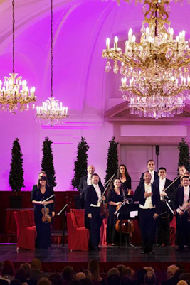 Orchestra performing at Schönbrunn Palace concert hall, Vienna.
