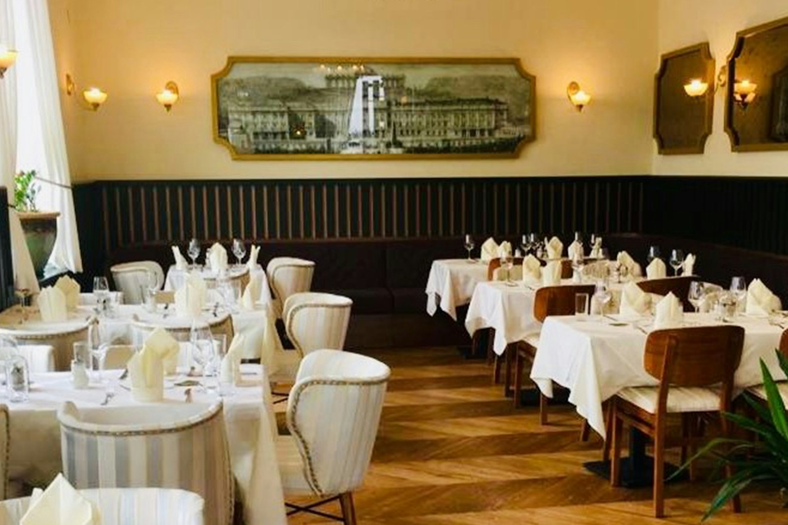 Elegant dining room set for a 3-course dinner at Schönbrunn Palace, Vienna.
