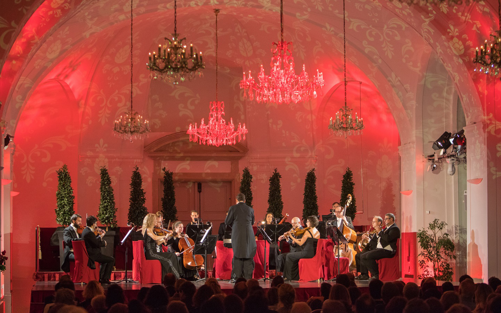 Orchestra performing at Schönbrunn Palace concert hall, Vienna.