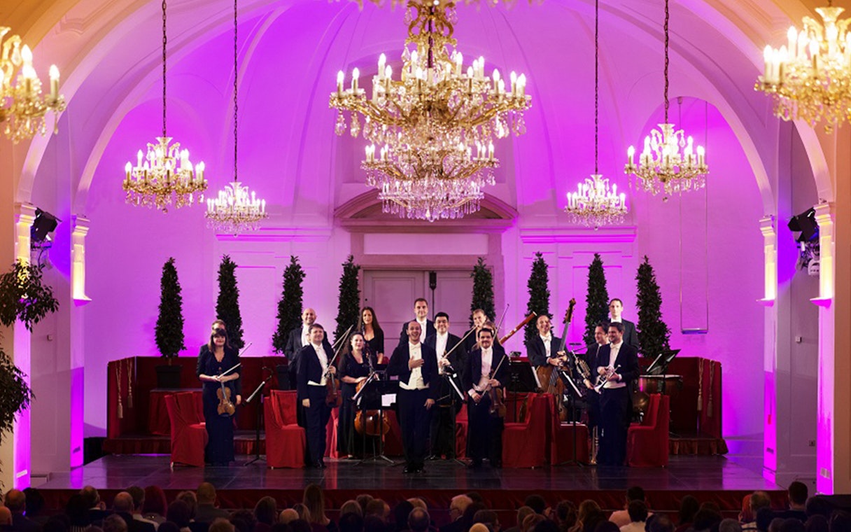 Orchestra performing at Schönbrunn Palace concert hall, Vienna.