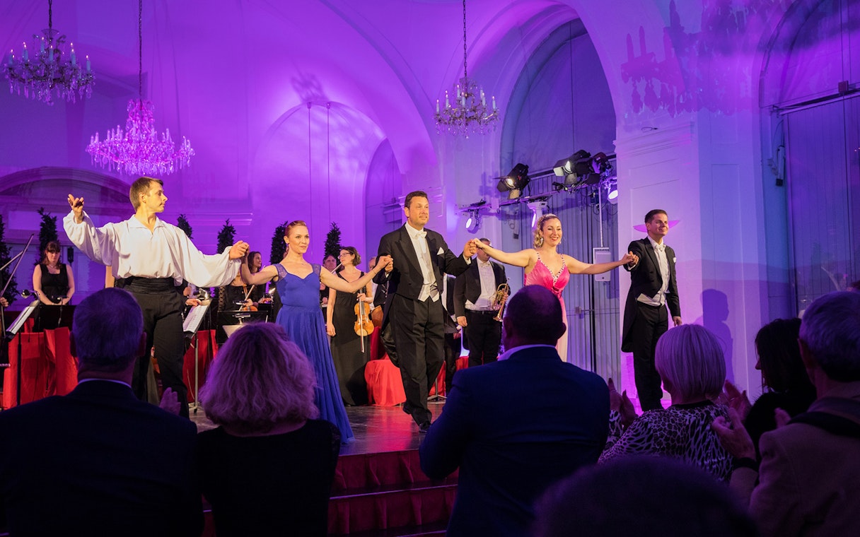 Performers taking a bow at a Mozart and Strauss concert in Schönbrunn Palace.