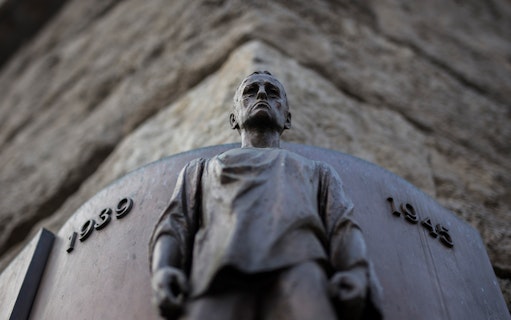 Statue commemorating historical events from 1939 to 1945 in Prague.