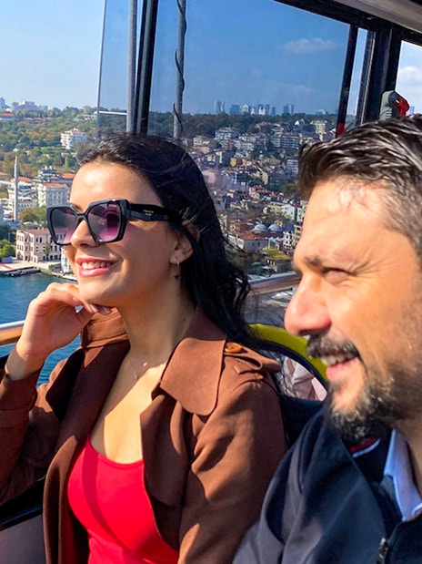Tourists enjoying views of Istanbul from a hop-on hop-off bus near the Bosphorus.