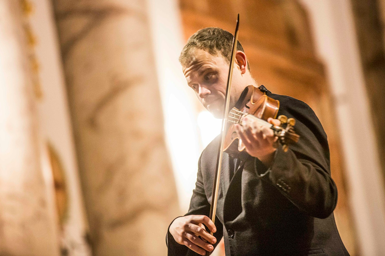 Violinist performing at Vivaldi’s Four Seasons concert in Karlskirche, Vienna.