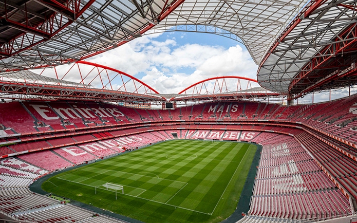SL Benfica Stadium with empty stands and green pitch, Lisbon, Portugal.