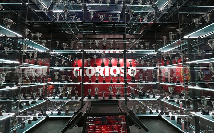 Trophy display at SL Benfica Museum during guided stadium tour.