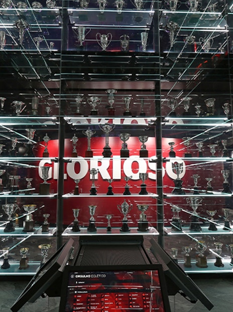 Trophy display at SL Benfica Museum during guided stadium tour.