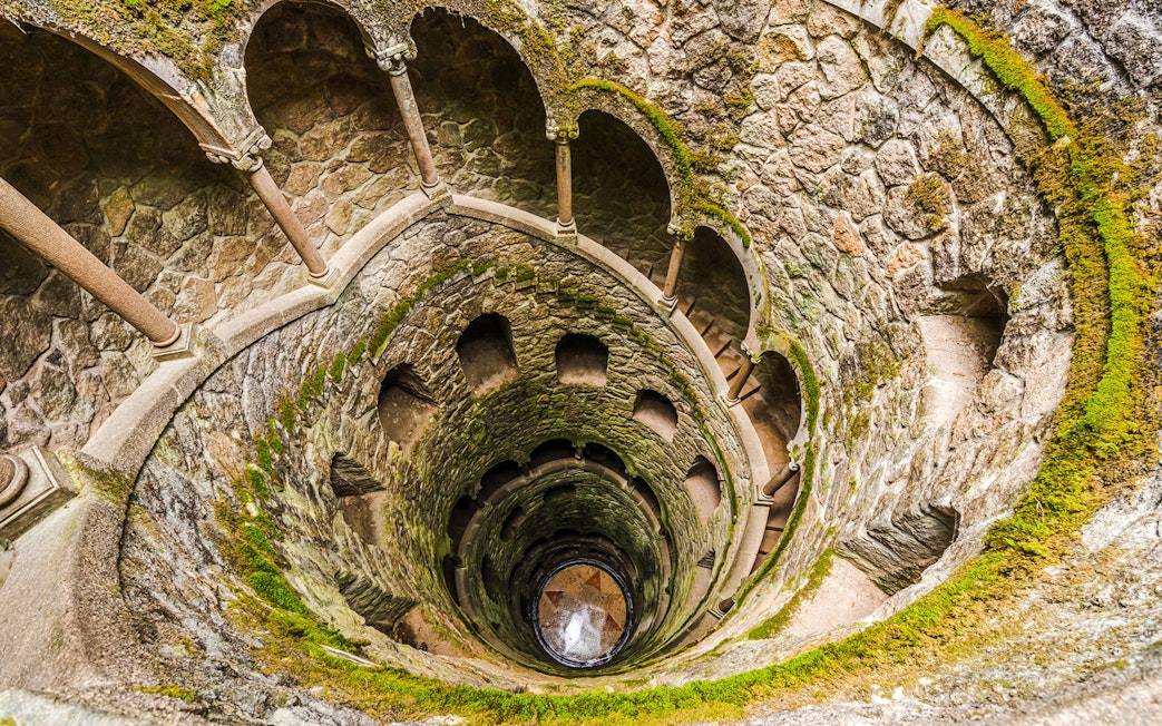 Quinta da Regaleira's Initiation Well spiral staircase in Sintra, Portugal.