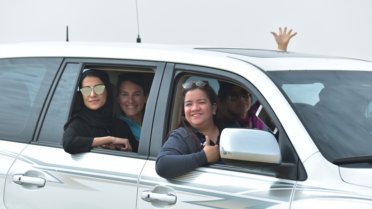 Group enjoying Doha Half-Day Desert Safari in a 4x4 vehicle.