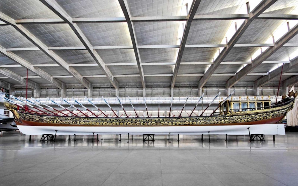 Decorative ship inside Lisbon's Maritime Museum, part of the Jerónimos Monastery tour.