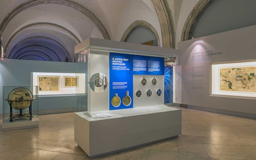 Astrolabe and ancient maps exhibit at Maritime Museum Lisbon.