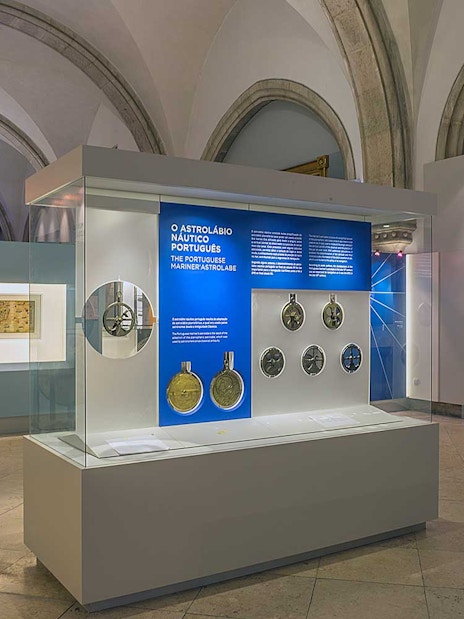 Astrolabe and ancient maps exhibit at Maritime Museum Lisbon.