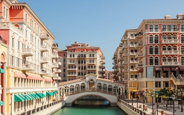 Colorful Venetian-style buildings and canal in The Pearl, Doha.