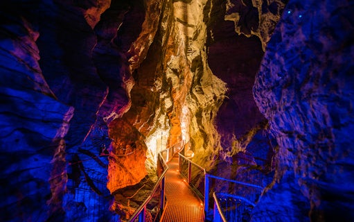 Walkway through illuminated Waitomo Glowworm Caves, New Zealand.