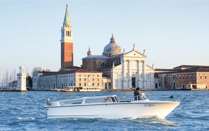 Private water taxi near San Giorgio Maggiore, Venice, with Marco Polo Airport transfer service.