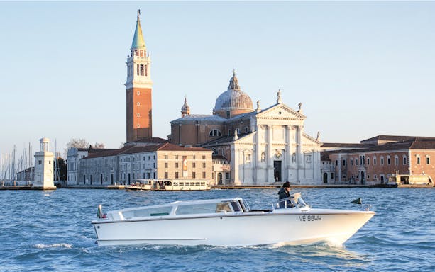 Private water taxi near San Giorgio Maggiore, Venice, with Marco Polo Airport transfer service.