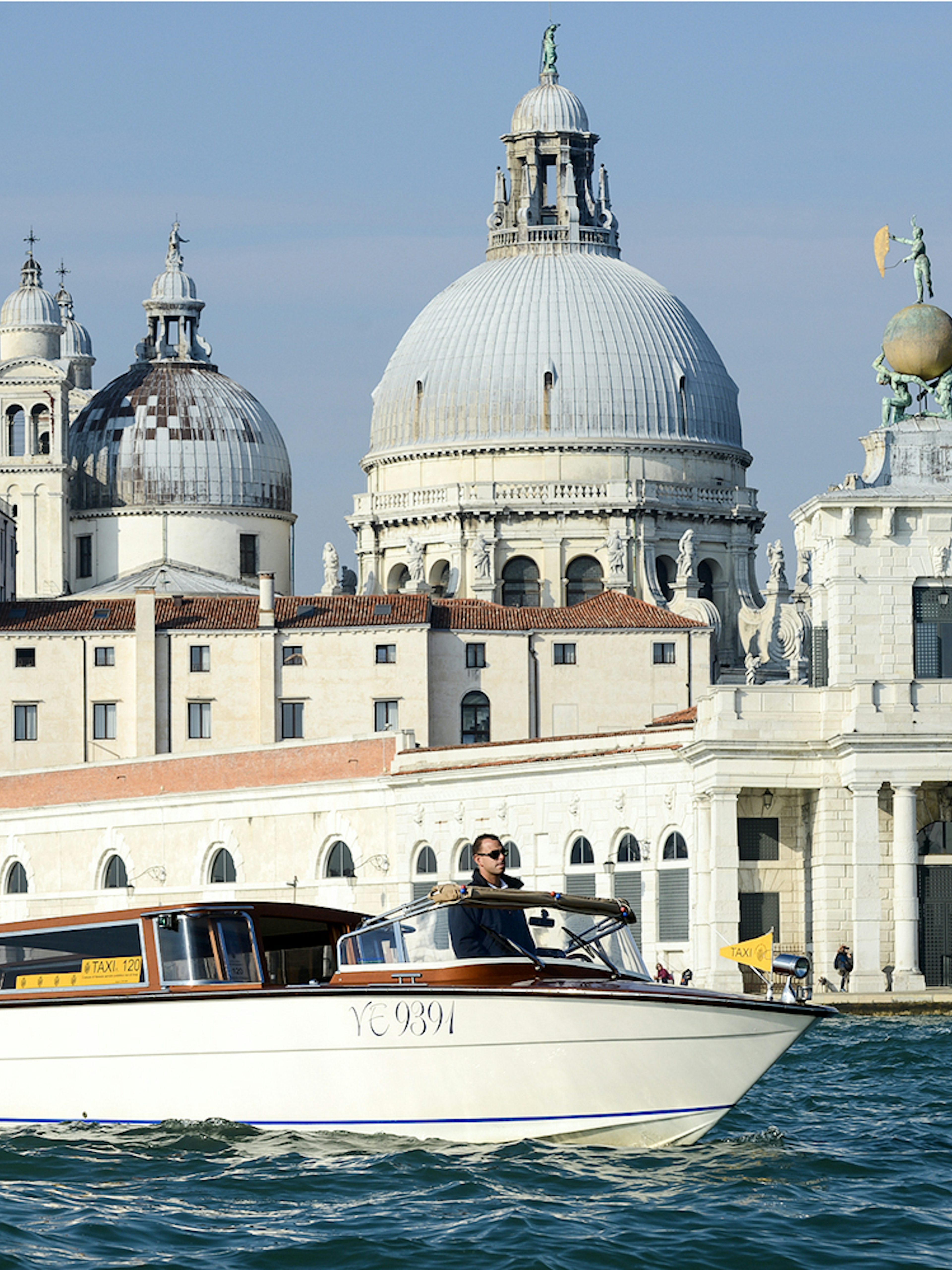 Private water taxi near Santa Maria della Salute, Venice, for Marco Polo Airport transfers.