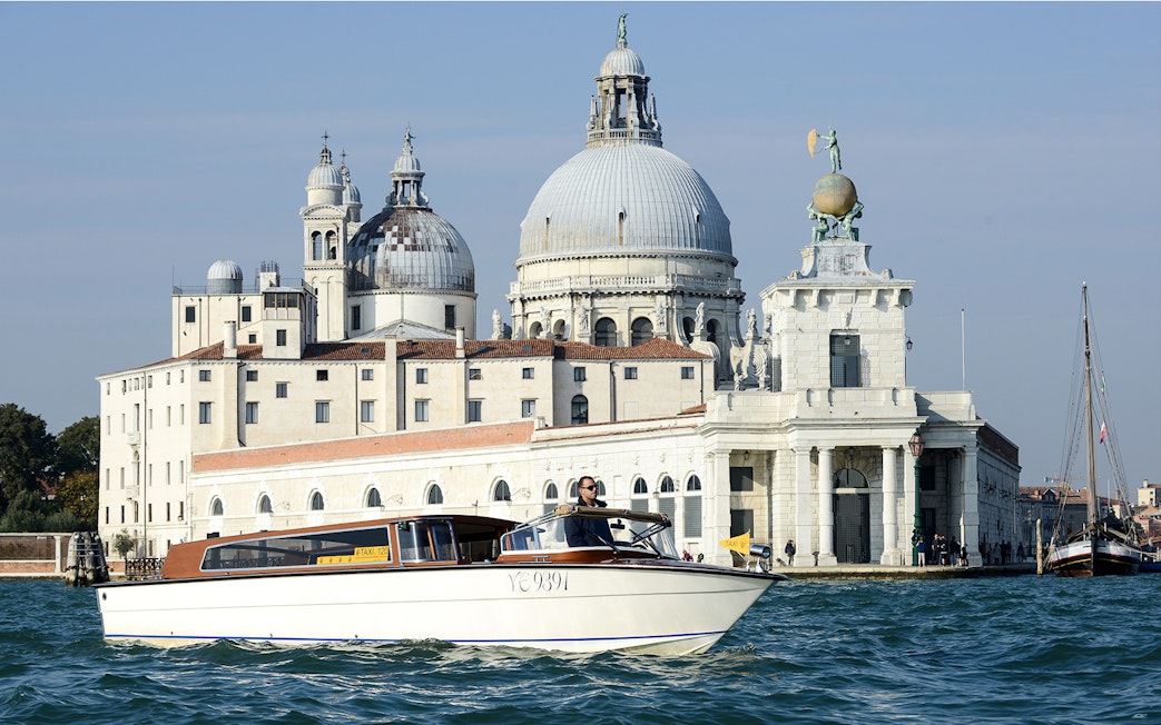 Private water taxi near Santa Maria della Salute, Venice, for Marco Polo Airport transfers.
