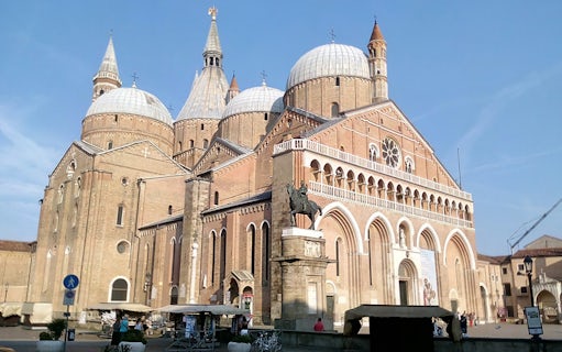 Basilica of Saint Anthony in Padua with equestrian statue, part of 24-hour bus tour.