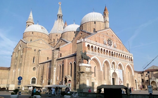 Basilica of Saint Anthony in Padua with equestrian statue, part of 24-hour bus tour.
