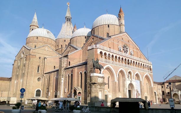 Basilica of Saint Anthony in Padua with equestrian statue, part of 24-hour bus tour.