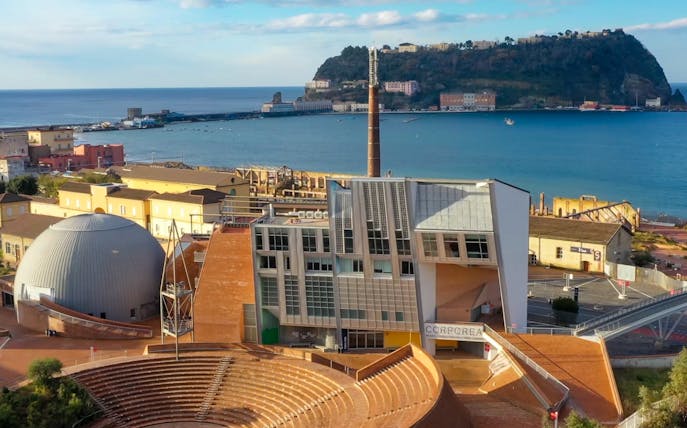 Città della Scienza museum with amphitheater and sea view in Naples, Italy.