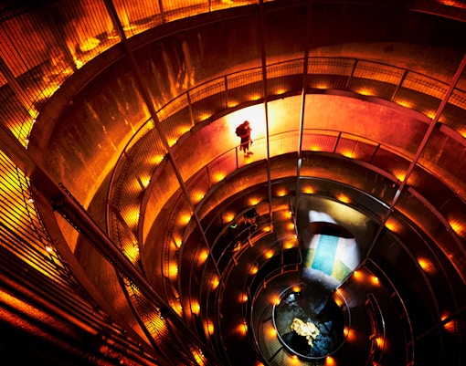 Spiral walkway inside Ruakuri Cave during guided tour, New Zealand.