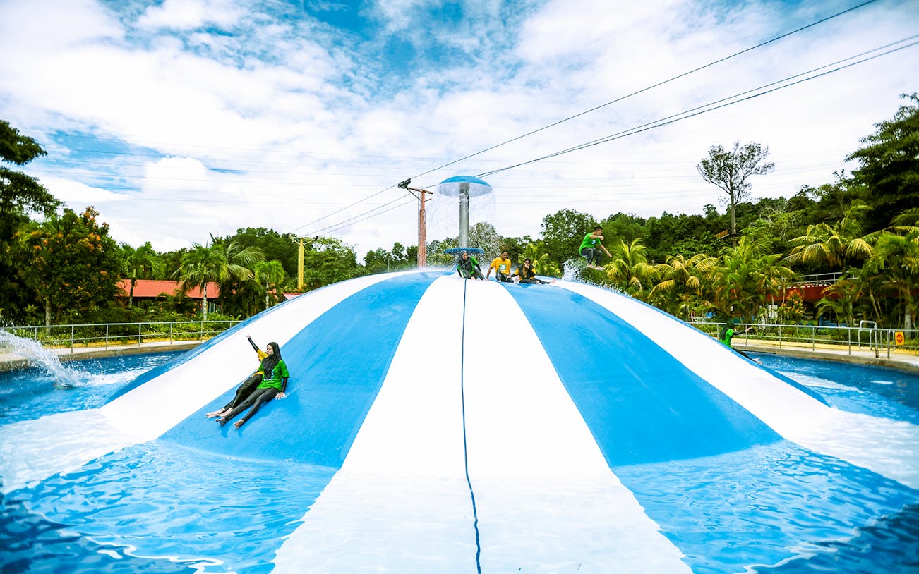 Visitors enjoying the water slide at Bukit Merah Laketown Waterpark.