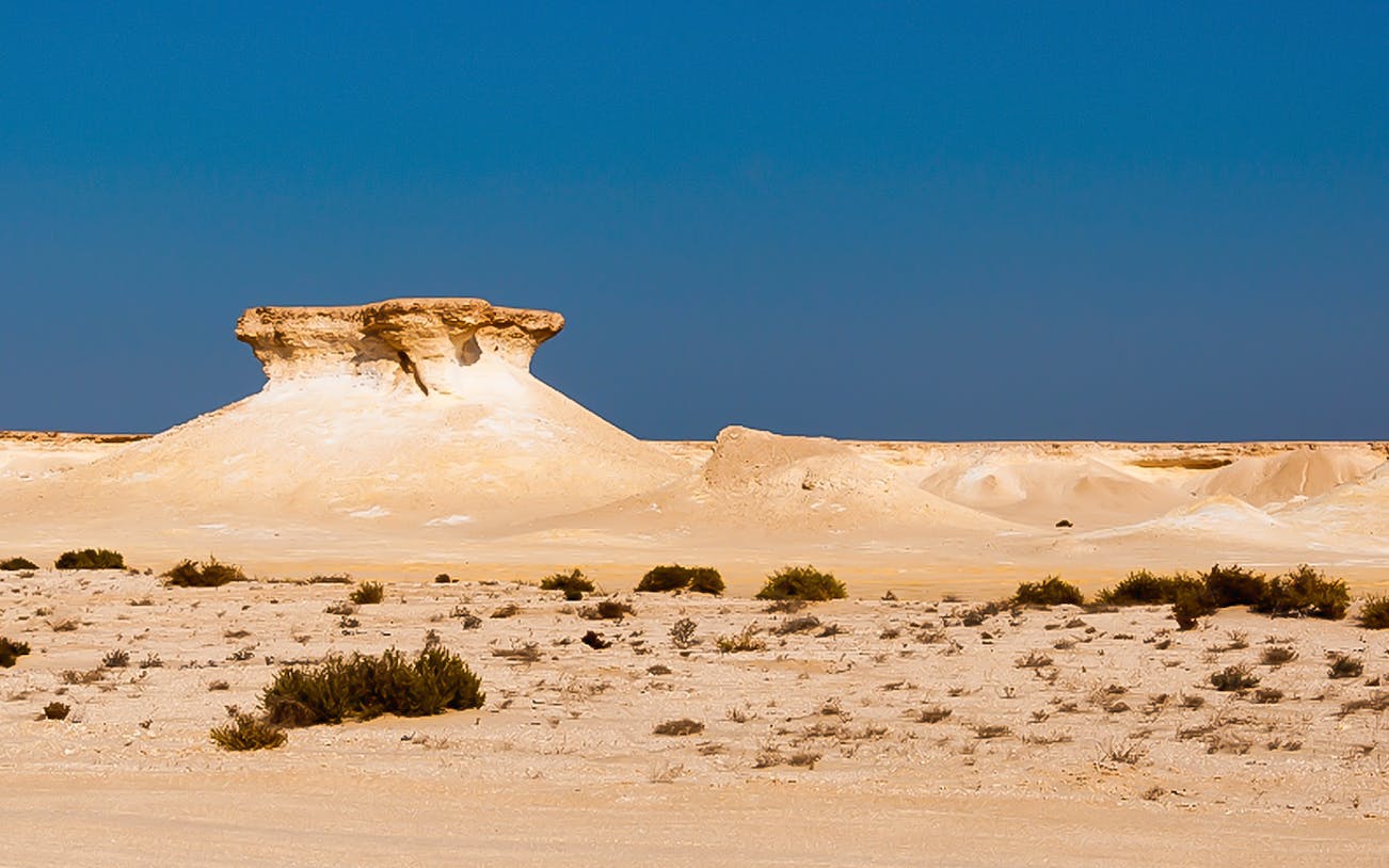 Zekreet Beach desert landscape with unique rock formations in Qatar.