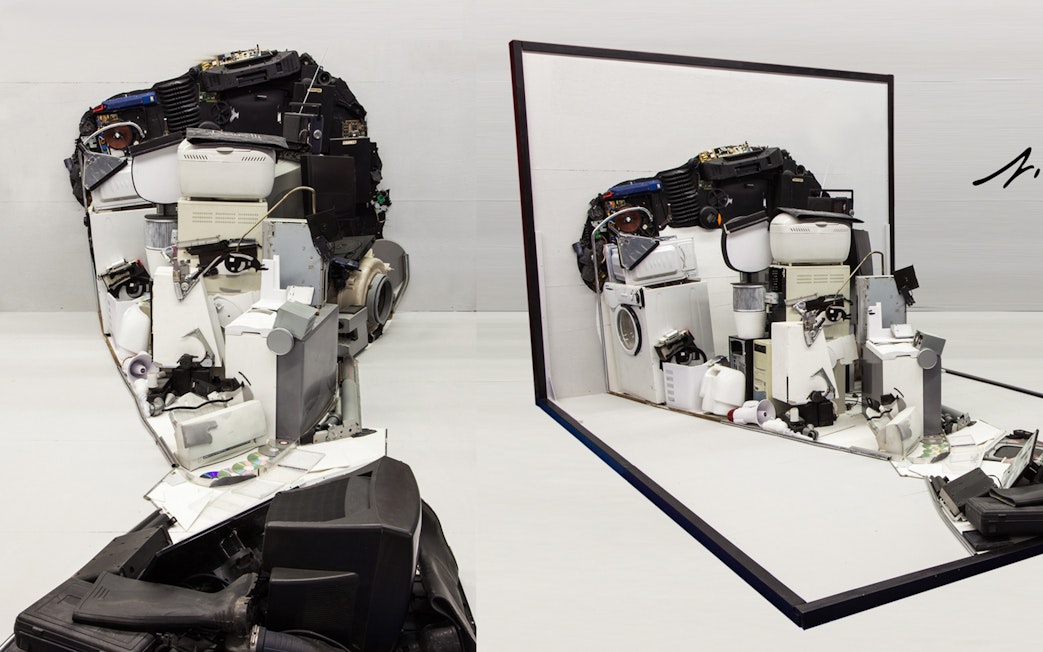 Illusion Art Museum Prague exhibit of a face sculpture made from electronic parts.