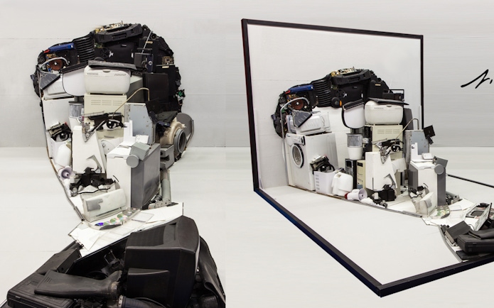 Illusion Art Museum Prague exhibit of a face sculpture made from electronic parts.