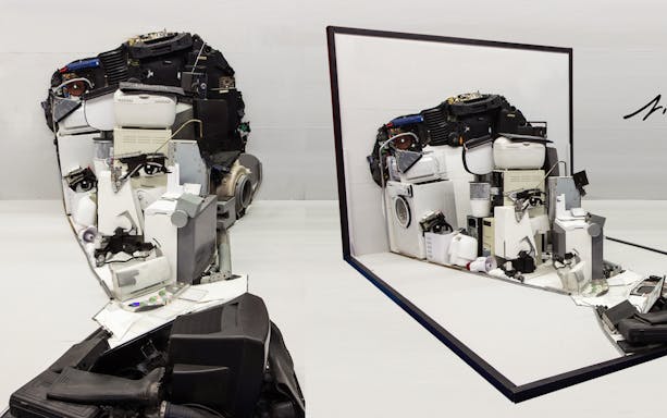 Illusion Art Museum Prague exhibit of a face sculpture made from electronic parts.