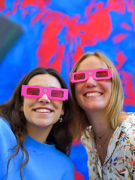 Visitors wearing 3D glasses at Illusion Art Museum Prague.