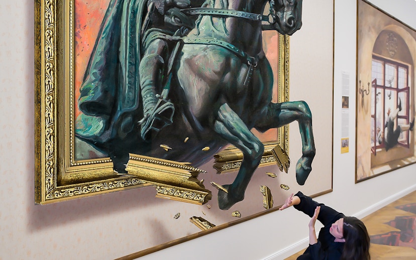 Horse sculpture illusion at Illusion Art Museum Prague with visitor interacting.