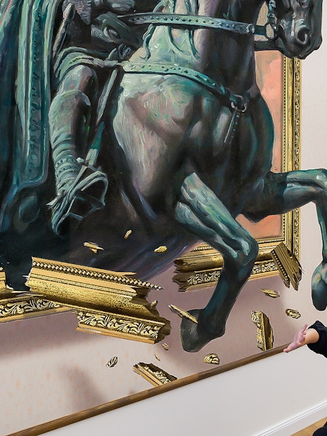 Horse sculpture illusion at Illusion Art Museum Prague with visitor interacting.